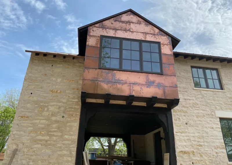 Copper metal panel facade on a stone building for Metal Roof Coating in North Canton